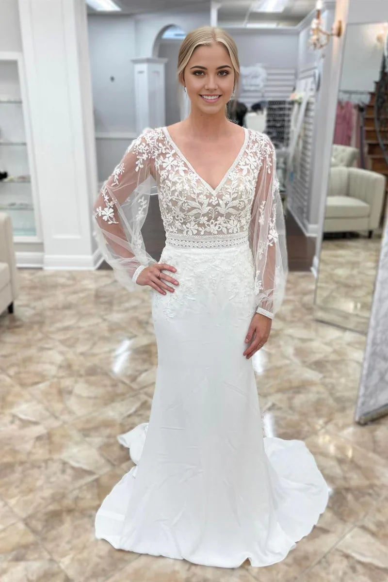 Vestido de novia largo de sirena con escote en V profundo y mangas ilusión con apliques